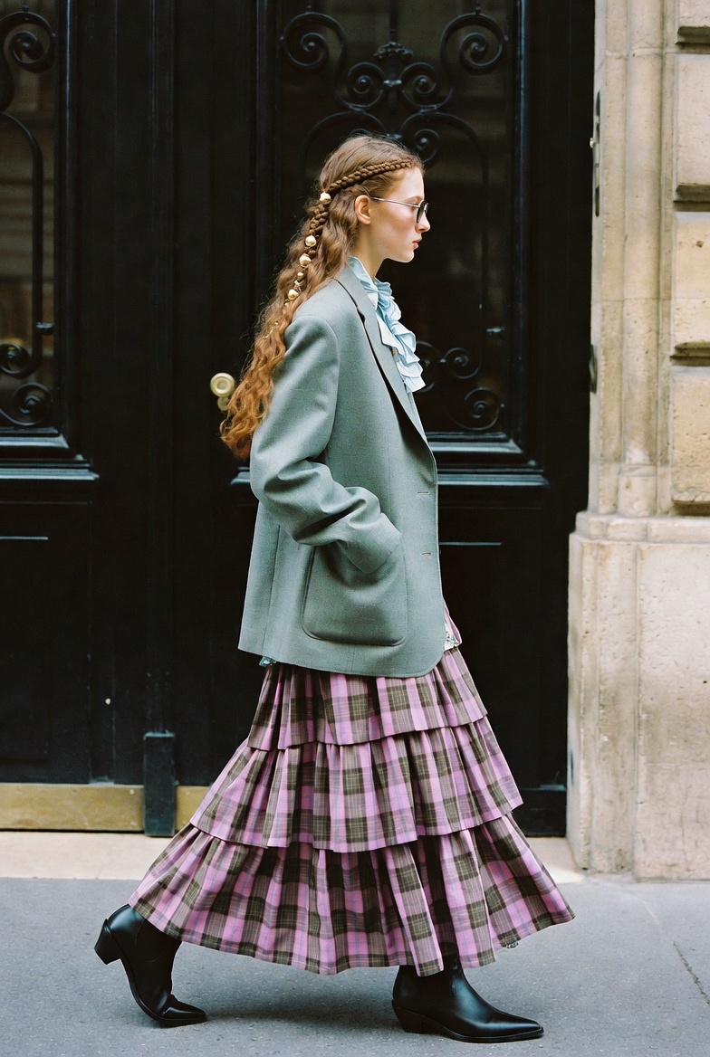 Check Mate — a tall slender model on a Paris street in autumn light wearing a checked wool coat over tailored trousers, the ESVRA Fashion edit on the Fall 2026 check trend