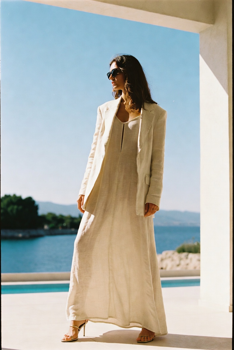 A woman in a linen dress and blazer dressed for evening at Lake Como, ESVRA Power of Linen edit
