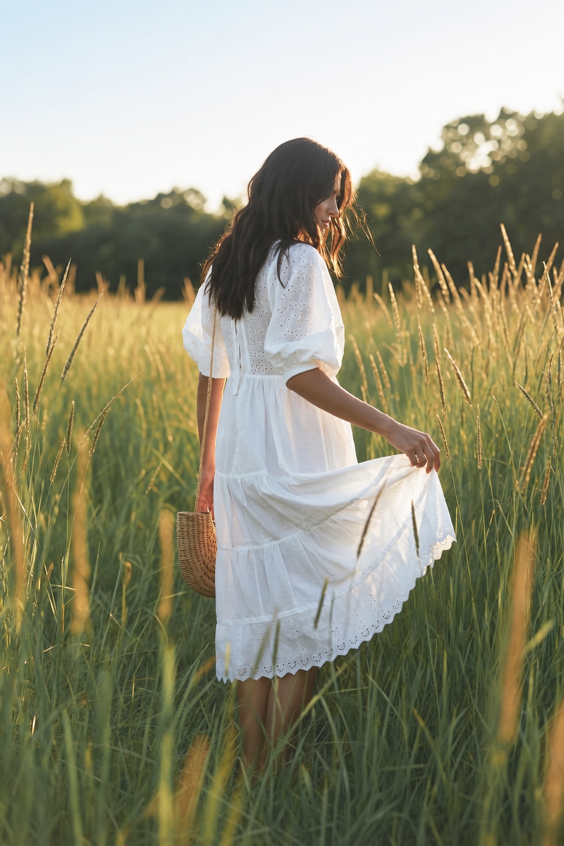 The Prairie Queen — a tall slender model in a deep red romantic ruffled tiered bohemian maxi dress walking through wildflowers on a California coastal cliff, the ESVRA styling edit on 2026's bohemian dress revival
