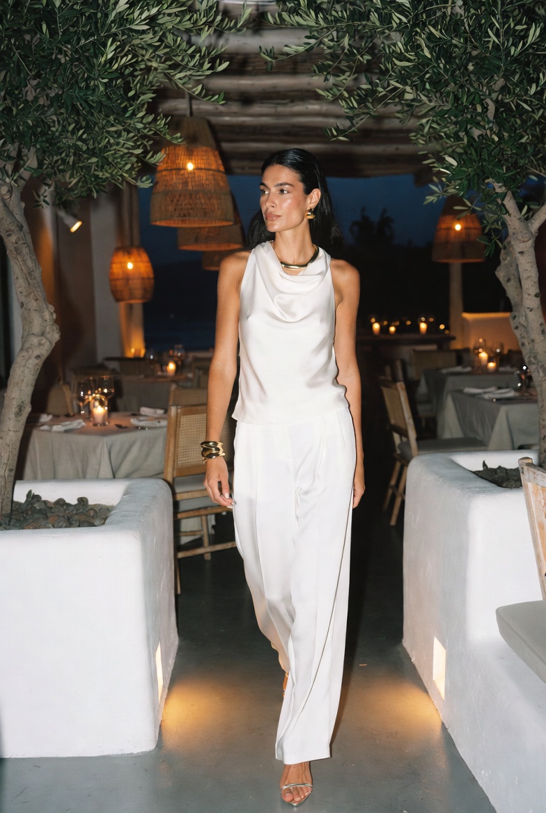 A woman in chic crochet at a luxury Mykonos beach club