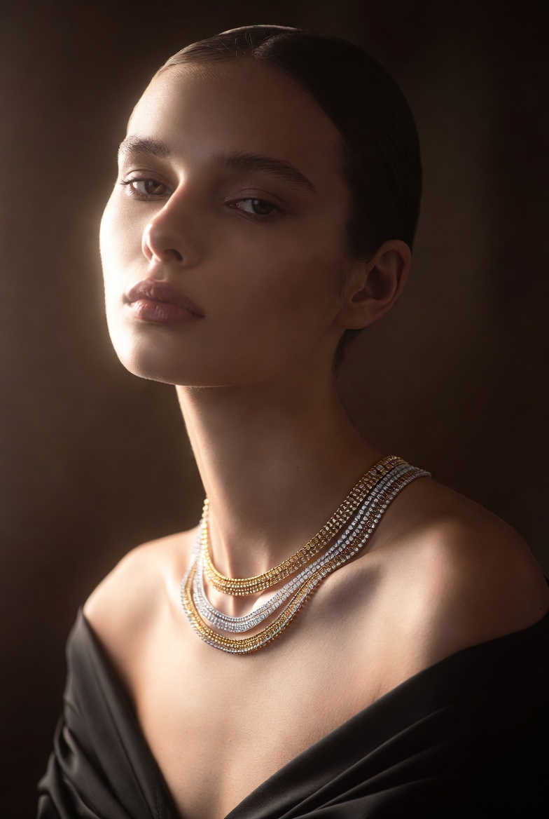 A model wearing fine gold and diamond necklaces
